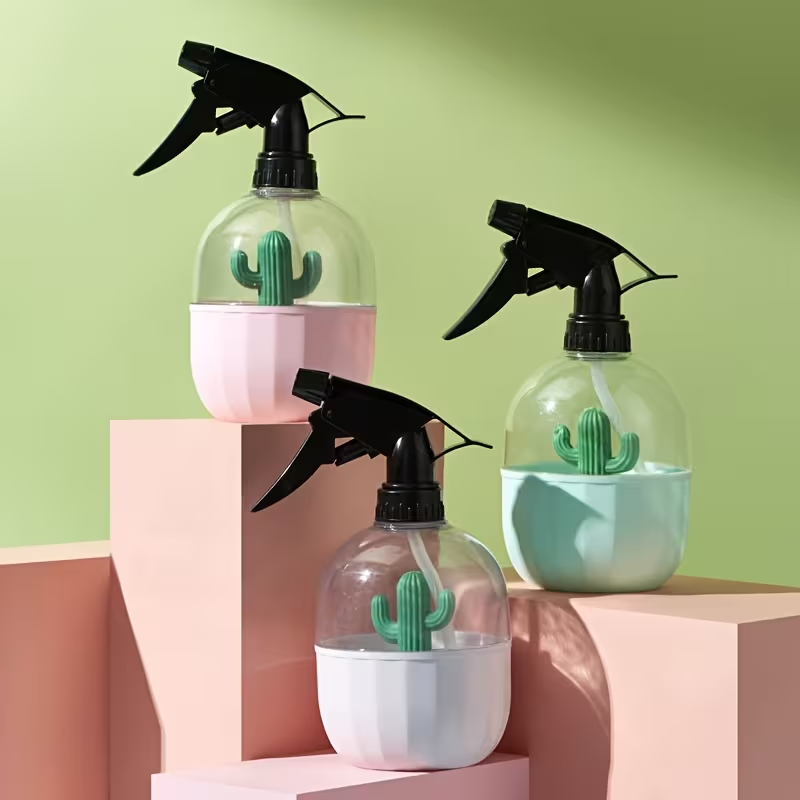 A handheld garden spray bottle for watering plants.