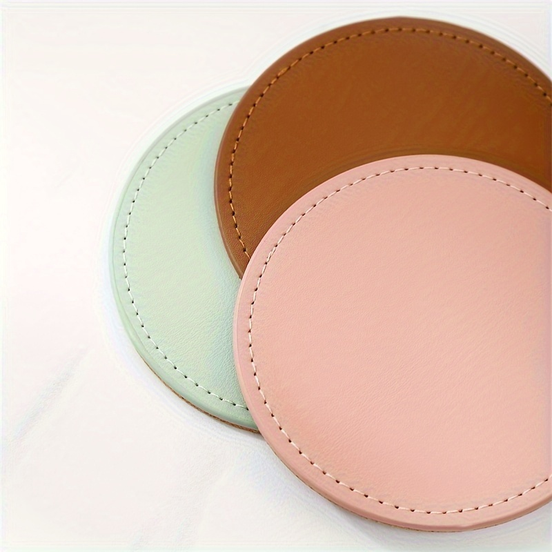 6 faux leather coasters with metal stands and cork bases