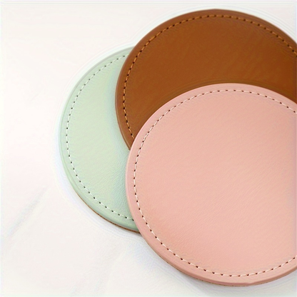 6 faux leather coasters with metal stands and cork bases
