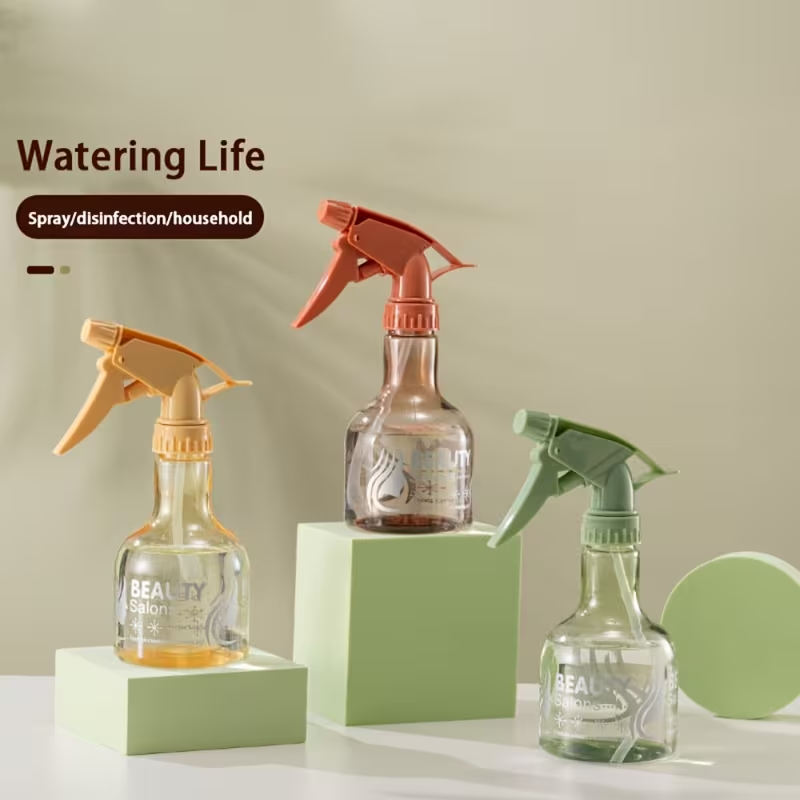 A handheld spray bottle with an ergonomic grip and precision nozzle.
