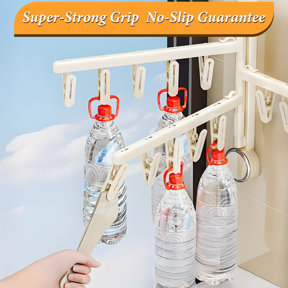 Foldable wall-mounted clothes rack with strong suction cups, saving space.